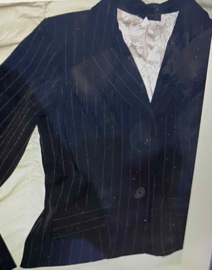 Fanny wears black jacket