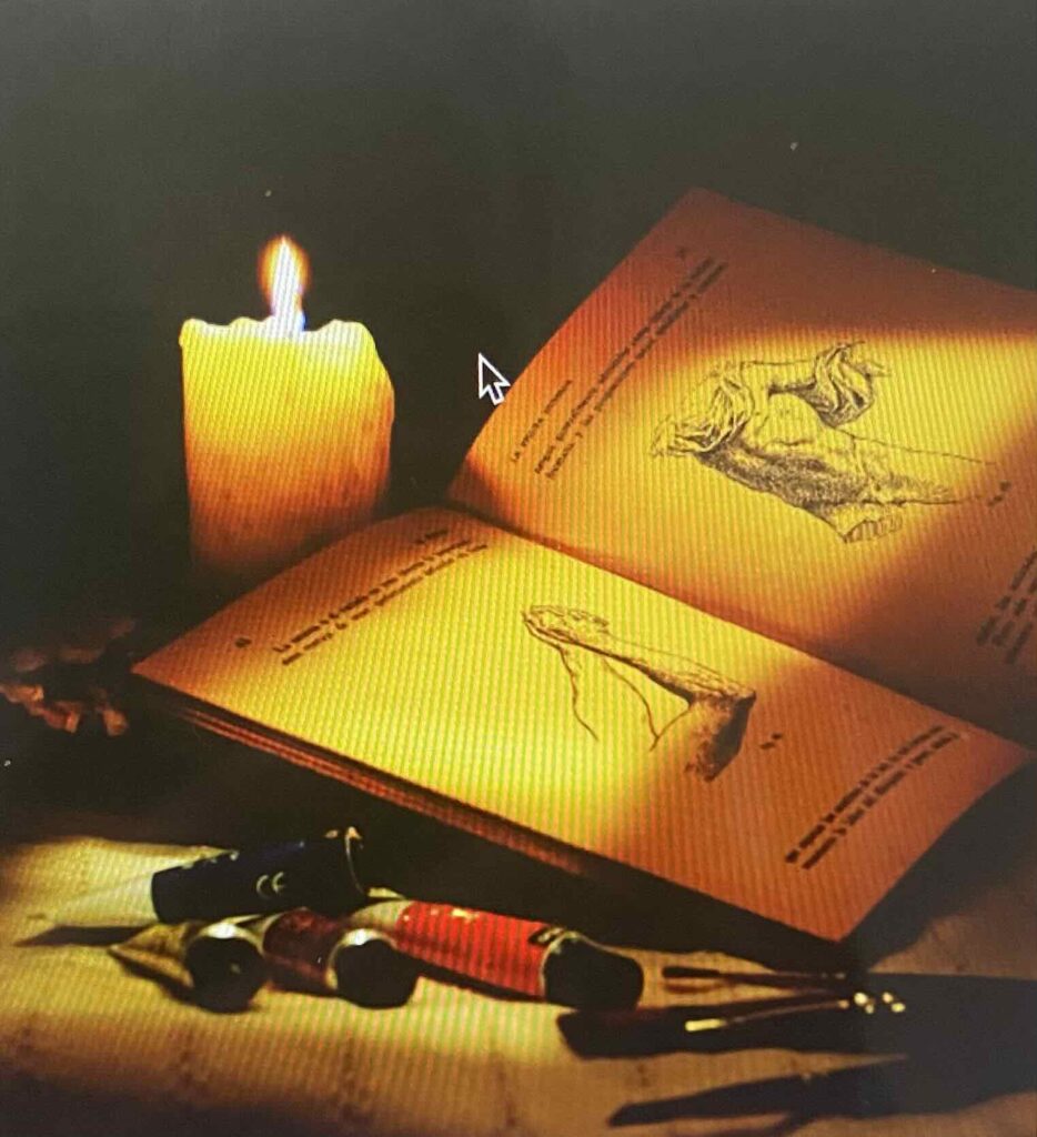 Small table with candle and a book.